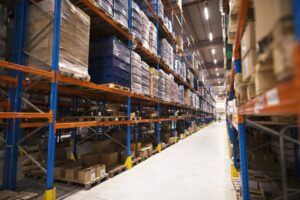 interior-large-distribution-warehouse-with-shelves-stacked-with-palettes-goods-ready-market 1 interior-large-distribution-warehouse-with-shelves-stacked-with-palettes-goods-ready-market 1